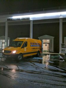 Commercial Restoration Van Outside Building